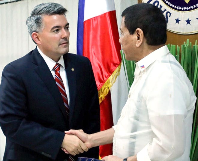 AP PHOTO/PHILIPPINES PRESIDENTIAL COMMUNICATIONS OPERATIONS OFFICE U.S. Sen Cory Gardner (left) meets with Philippines President Rodrigo Duterte on May 31 at Villamor Air Base in Manila, Philippines.