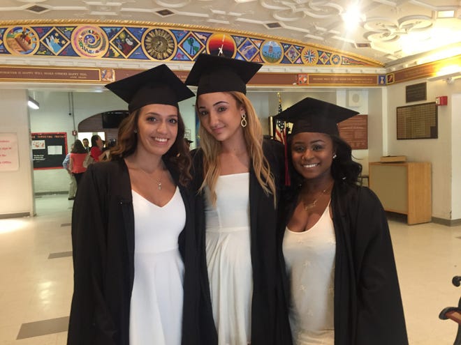 From left to right: Nathalia Tapia, Elizabeth Santourian and Khadeeb Inniss. The Watertown High School Class of 2017 graduated at the WHS gym on Friday, June 2.

[WickedLocal Photo / Jordan Frias]