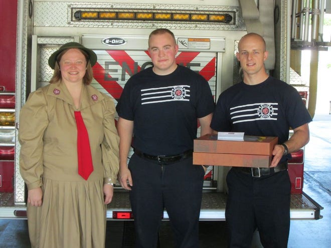 Lt. Sarah Eddy of the Canton Salvation Army delivers donuts to members of the Canton Fire Department Friday in recognition of Salvation Army National Donut Day.