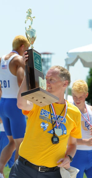East Canton coach Tom Loy with the OHSAA Division III State Track Championship trophy June 3, 2017. (CantonRep.com / Ray Stewart)