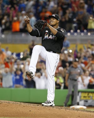 Marlins pitcher Edinson Volquez celebrates after throwing a no-hitter in a 3-0 Miami victory over the Diamondbacks. It was the first no-hitter of Volquez's career. [Wilfredo Lee/The Associated Press]