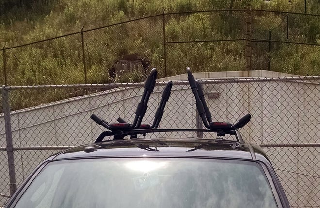 Luggage racks with flexible cross braces require the use of kayak racks that attach near the outside edge, where the cross brackets are stiff enough to prevent damage to the vehicle roof. [JERRY BUSH/CONTRIBUTED PHOTO]