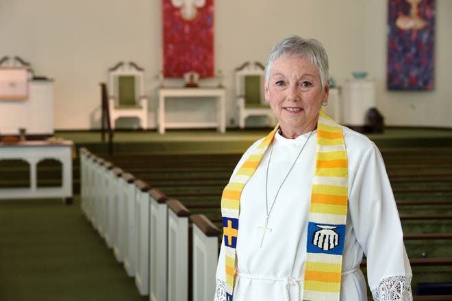The Rev. Sharon Schuler stands in the sanctuary of the First Presbyterian Church Fort Walton Beach. The church's governing board has sent a letter to the city that states the proposed fire fees would place an unfair burden on churches. "I appreciate what they do and I know they need the money," says Schuler. "I just wish there was another way." [DEVON RAVINE/DAILY NEWS]