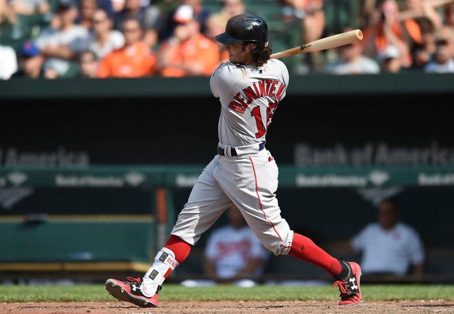 Boston Red Sox's Andrew Benintendi follows through on an RBI single against the Baltimore Orioles in the ninth inning of a baseball game, Sunday, June 4, 2017, in Baltimore. Benintendi also had two home runs.