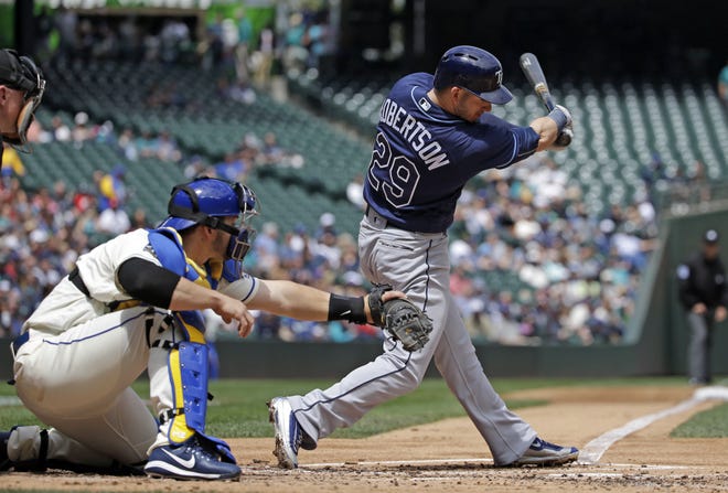 Tampa Bay Rays' Daniel Robertson swings and misses to strike out as Seattle Mariners catcher Mike Zunino catches the ball to end the top of the second inning Sunday, in Seattle. Tampa Bay lost, 7-1. [THE ASSOCIATED PRESS / ELAINE THOMPSON]