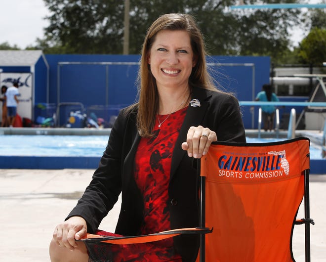 Joleen Cacciatore Miller, executive director of the Gainesville Sports Commission, at the Dwight H. Hunter "Northeast" Pool Thursday in Gainesville. [Brad McClenny/Staff photographer]
