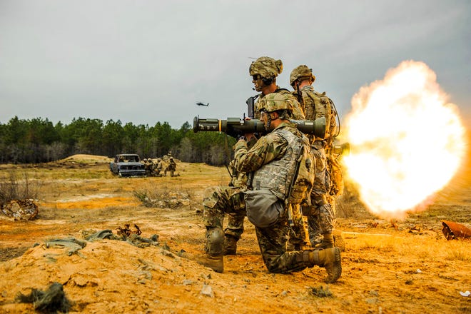 In this March 22, 2017 photo, soldiers with 1st Brigade Combat Team, 82nd Airborne Division fire single-use AT-4 rockets during a live fire training exercise on Fort Bragg, N.C. The training was in preparation for a coming deployment to Afghanistan. (Shane Dunlap /The Fayetteville Observer via AP)