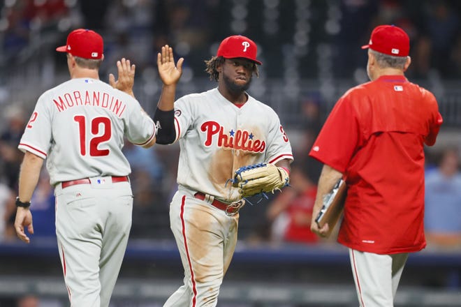 Phillies centerfielder Odubel Herrera celebrates with his teammates after the win against the Atlanta Braves on Monday, June 5, 2017, in Atlanta.