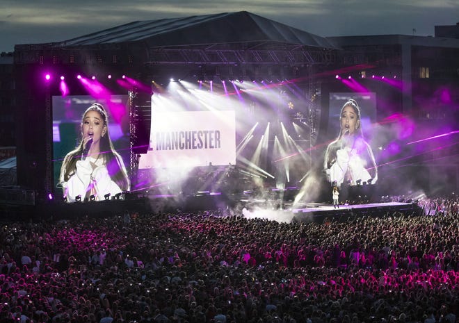 In this Sunday, June 4, 2017, handout photo provided by Danny Lawson for One Love Manchester, singer Ariana Grande performs at the One Love Manchester tribute concert in Manchester, north western England, Sunday, June 4, 2017. One Love Manchester is raising money for those affected by the bombing at the end of Ariana Grande's concert in Manchester on May 22, 2017. DANNY LAWSON VIA AP