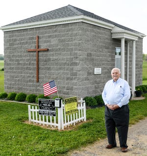 Normand Laliberte built a columbarium behind St. Jacob's Lutheran Church in Lake Township in response to the rising cost of burials. (CantonRep.com / Michael Balash)
