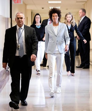 Andrea Constand walks to the courtroom during Bill Cosby's sexual assault trial at the Montgomery County Courthouse in Norristown, Pa., Tuesday, June 6, 2017. (AP Photo/Matt Rourke, Pool)