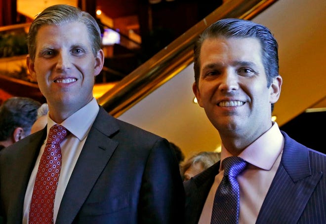 Eric Trump, left, and Donald Trump Jr., executive vice presidents of The Trump Organization, pose for a photograph at an event in New York on Monday.