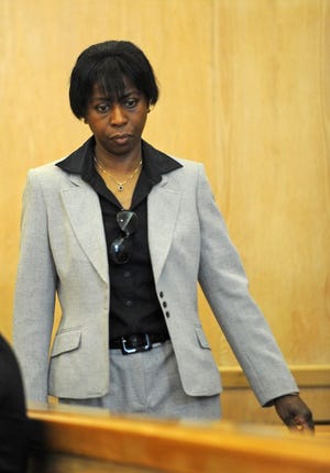 Sandra Lucien-Calixte, 48, of Stoughton, in Stoughton District Court on Monday, April 14, 2014, facing charges of permitting serious injury to an elder after a 75-year-old woman in her care.