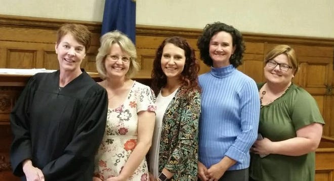 Hillsdale County Probate Court Judge Michelle Bianchi (left) poses for a picture with CASA volunteers Angela Manifold, Stephanie Delaney, Michelle Haylett, and Volunteer Coordinator Heather Upton. [COURTESY PHOTO]