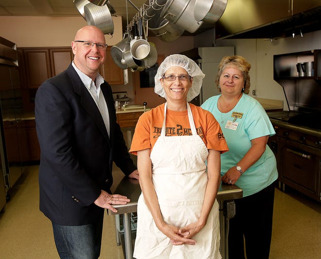 From left, Ted Watko, CEO of Meals On Wheels of Stark and Wayne Counties, Judy Marshall, coordinator for Meals on Wheels, along with Caroline Ferrel, director of the Massillon Senior Center pose for a portrait in the center's kitchen.

 (IndeOnline.com / Kevin Whitlock)