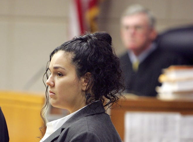 In this file image from Nov. 29, 2010, Emilia Carr watches potential jurors leave for a break as jury selection began in her murder trial at the Marion County Judicial Center. Carr and her boyfriend Joshua Fulgham have been convicted of first-degree murder in the 2009 death of Heather Strong, his estranged wife. [Alan Youngblood/Ocala Star-Banner]