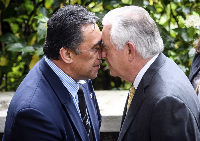 U.S. Secretary of State Rex Tillerson, right, receives a "hongi" a traditional maori welcome at Premier House in Wellington, New Zealand, Tuesday, June 6, 2017. THE ASSOCIATED PRESS