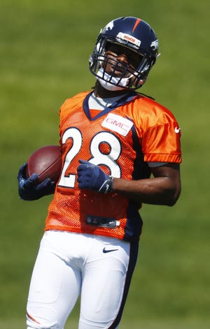 Denver running back Jamaal Charles takes part in a drill during the team's minicamp Monday. Charles, the Chiefs' career rushing leader, said he has always loved the Broncos. [David Zalubowski/The Associated Press]