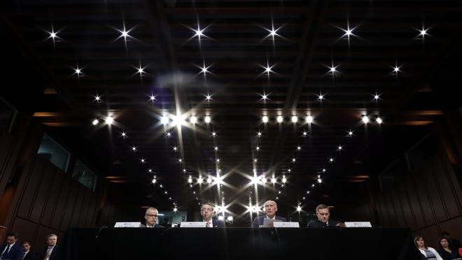 From left, Acting FBI Director Andrew McCabe, Deputy Attorney General Rod Rosenstein, National Intelligence Director Dan Coats, and National Security Agency Director Adm. Michael Rogers are seated during a Senate Intelligence Committee hearing about the Foreign Intelligence Surveillance Act, on Capitol Hill, Wednesday, June 7, 2017, in Washington. (AP Photo/Alex Brandon)