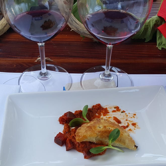 2013 Tarima Hill Monastrell, Alicante, left, and 2014 Bokisch Monastrell, Lodi are paired with an eggplant empanada, romesco and Spanish chorizo at a recent Liquid Learning Spanish Wine and Tapas Tasting in Escalon. [BOB HIGHFILL/THE RECORD]