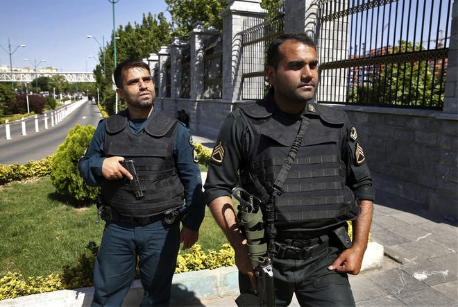 Police patrol outside Iran's parliament building after an assault by several attackers that was claimed by the Islamic State group, in Tehran, Iran, Wednesday, June 7, 2017. Gunmen and suicide bombers attacked IranþÄôs parliament and the shrine of its revolutionary leader, killing at least 12 people, wounding dozens and igniting an hours-long siege at the legislature that ended with four attackers dead. It marked the first time the Sunni extremists have taken responsibility for an assault in Shiite-majority Iran. THE ASSOCIATED PRESS