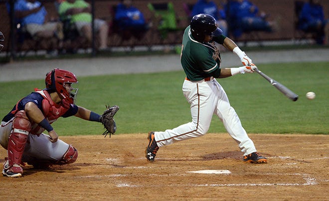 Justin Twine of the Greensboro Grasshoppers makes contact against the Hagerstown Suns on Wednesday night at Burlington Athletic Stadium.