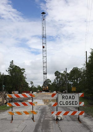 Construction equipment towers over the site of the Arthur Drive Bridge Replacement on Wednesday in Lynn Haven. The bridge spans Lynn Haven Bayou. [HEATHER HOWARD/THE NEWS HERALD]
