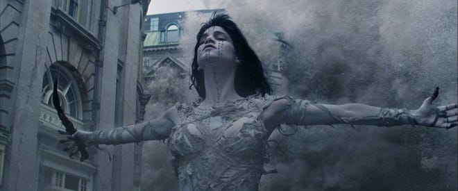 Ahmanet (Sofia Boutella), grasping the Dagger of Set, unleashes havoc on London. [Courtesy of Universal Pictures]