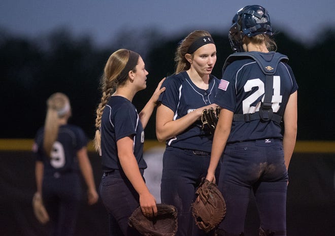 Council Rock North pitcher Jenna Khantzian is joined in the circle by Taylor Briggs (left) and catcher Taylor Amazeen (24) during the PIAA Class 6A softball quarterfinal game against Hazleton Thursday night, June 8, 2017 in Allentown. CR North lost 6-5 to Hazleton.