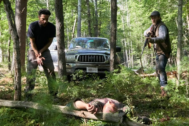 Will (Christopher Abbott) and Paul (Joel Edgerton) do away with an attacker in the woods. [Photo by Eric McNatt]