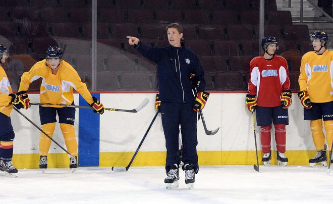 Former Erie Otters head coach Kris Knoblauch, center, addresses team members during practice at Erie Insurance Arena in Erie on Sept. 29, 2015. Knoblauch has been hired as an assistant coach for the NHL's Philadelphia Flyers. [FILE PHOTO/ETN]