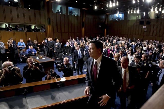 Former FBI Director James Comey departs after testifying during a Senate Intelligence Committee hearing on Capitol Hill on Thursday. [ANDREW HARNIK/AP]