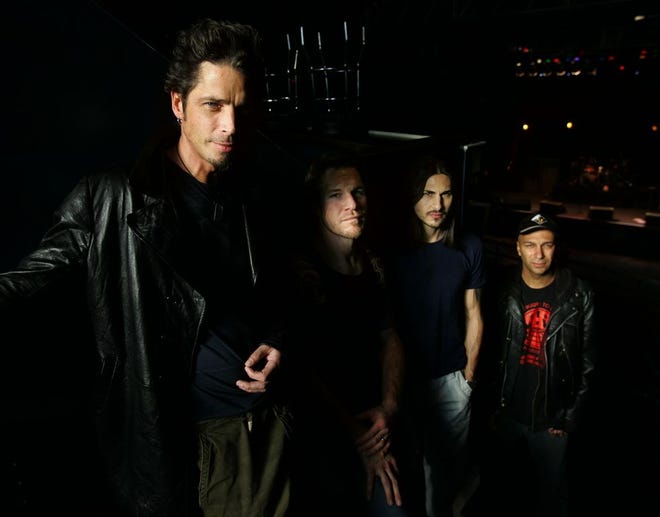 Audioslave band members Chris Cornell, left to right, Tim Commerford, Brad Wilk and Tom Morello pose before the start of their performance at the 9:30 Club in Washington, D.C. on May 1, 2005. [AP Photo/Manuel Balce Ceneta, File]