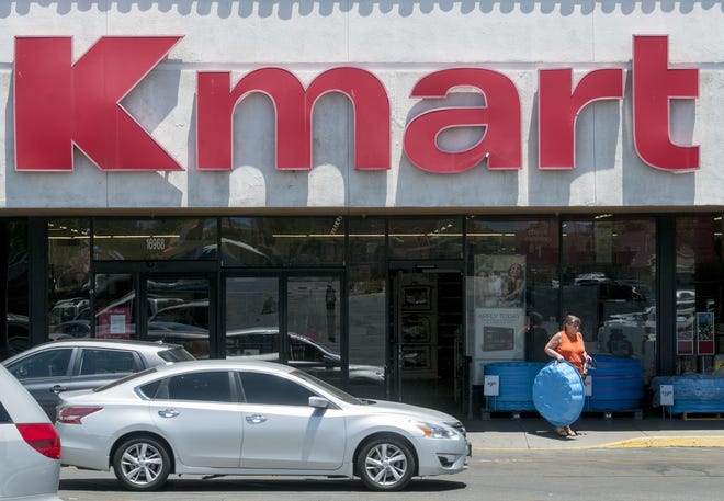 A customer carries a small pool out of the Kmart in Hesperia on Wednesday. The Local Kmart and Sears stores are not listed on the latest round of store closures. [James Quigg, Daily Press]