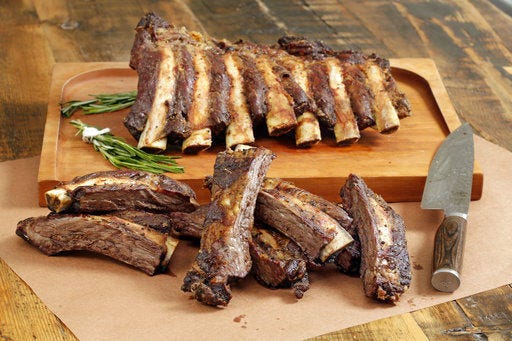 This April 3, 2017 photo shows beef rib “Brontosaurus Bones” at the Institute of Culinary Education in New York. This dish is from a recipe by Elizabeth Karmel. (AP Photo/Richard Drew)