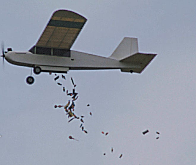 Candy drops from a model airplane during a previous “Big Bird” fun-fly in Copan. The Bartlesville Falcons Radio Control Model Airplane Club will host this year’s event from 9 a.m. to 4 p.m. Saturday at the Copan Model Air Park in Copan. COURTESY VERN SPAIN