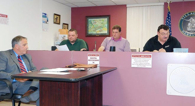 From left are Herkimer Village Attorney Nicholas Macri, Trustees Fred Weisser and Delbert Ball and Mayor Tony Brindisi during Monday’s meeting of the Herkimer village board. [DONNA THOMPSON/TIMES TELEGRAM]
