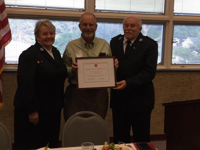 The Salvation Army’s top Christmas bell ringer in Cleveland County, Bob Mori of Shelby, received a framed certificate of appreciation at the recent National Salvation Army Week dinner held May 18. Sgts. Les and Mary Ashby made the presentation to Mori, who they say was available “at the drop of a hat.” [Special to The Star]