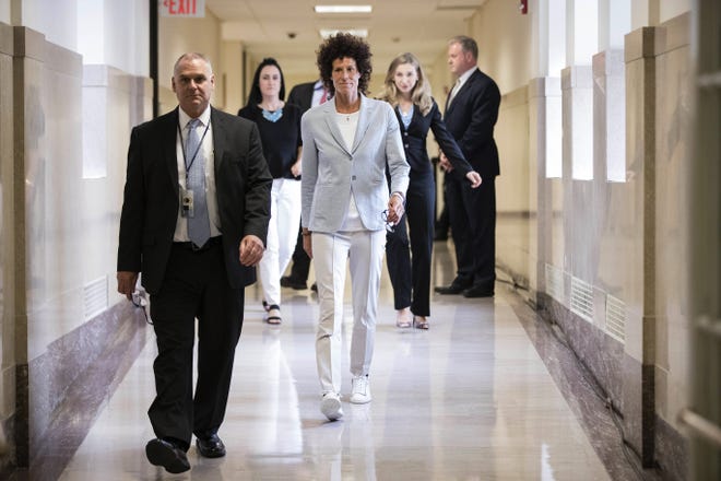 Andrea Constand, center, walks to the courtroom during Bill Cosby's sexual assault trial at the Montgomery County Courthouse in Norristown, Pa., Tuesday, June 6, 2017. Cosby is accused of drugging and sexually assaulting Constand at his home outside Philadelphia in 2004. (AP Photo/Matt Rourke, Pool)