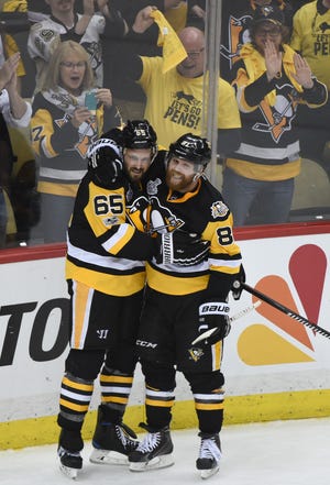 Phil Kessel, right, celebrates with Ron Hainsey after Hainsey's goal in the second period of Game 5 against the Nashville Predators at PPG Paints Arena.