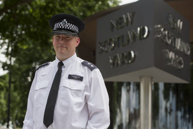 Metropolitan Police Inspector Jim Cole poses for a photo at New Scotland Yard, London, where he described his role in the police response to the London Bridge attack, Friday, June 9, 2017. One of the first police officers on the scene of the London Bridge attack says he was met by pandemonium, as people fled in panic and the wounded lay on sidewalks. (David Mirzoeff/Pool via AP)