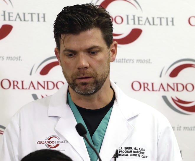 This June 14, 2016 file photo shows Dr. Chadwick Smith, one of the doctors that treated victims of the Pulse nightclub shooting, as he describes how he and others called for reinforcements that night, at a news conference at the Orlando Regional Medical Center in Orlando. Smith is used to confronting human suffering head-on in the operating room. But the sheer number of victims that night, 49 dead, 53 wounded, and the flood of relatives to the hospital left its mark on even a veteran like Smith. [JOHN RAOUX / ASSOCIATED PRESS]