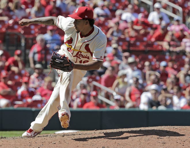St. Louis starting pitcher Carlos Martinez pitched around four hits while striking out 11 in his first career complete-game shutout, a 7-0 victory over Philadelphia on Saturday. [Tom Gannam/The Associated Press]