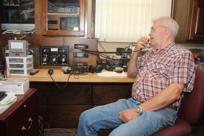 Cletus Brooks, the local coordinator of the Radio Amateur Civil Emergency Service, conducts a systems check Thursday.