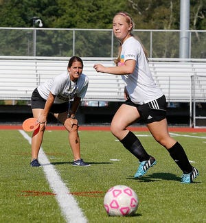 East Bridgewater girls soccer coach Pam Ross watches Sydney Hickey during practice on Tuesday, Sept.1, 2015.