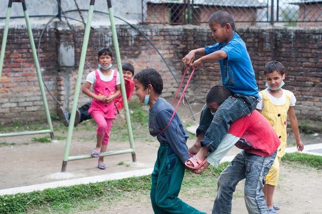 Children playing horse at Next Generation Nepal's transition center in Nepal. (Angsten Lama/NGN)(Sundup Dorje Lama/NGN)