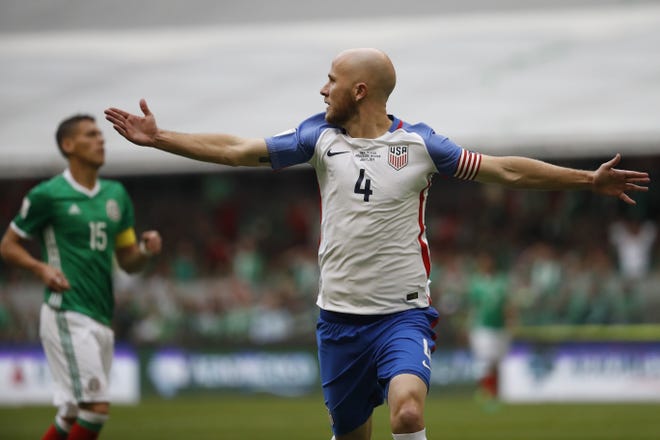 Michael Bradley of the United States celebrates after scoring against Mexico in the sixth minute. [Eduardo Verdugo/The Associated Press]