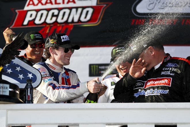 Ryan Blaney celebrates in Victory Lane after winning the NASCAR Cup Series Pocono 400 on Sunday in Long Pond, Pa. It was Blaney's first victory at Pocono. [AP Photo/Matt Slocum]