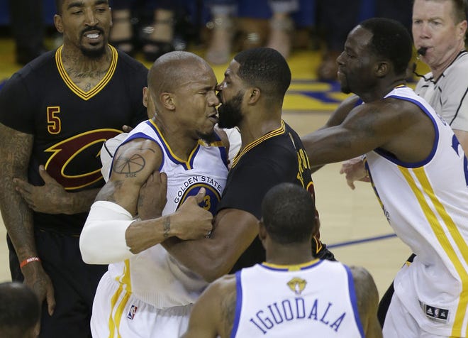 Cavaliers center Tristan Thompson and Golden State forward David West get into a confrontation during the first half of Game 5 of the NBA Finals in Oakland, California, on Monday, June 12, 2017.