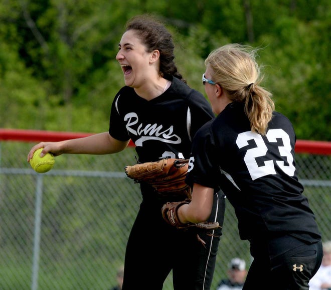 South Side's Regan Hozak (23) and Rachael Pieto are all smiles after Hozak made a catch in center field against Chartiers-Houston in a WPIAL softball playoff game Tuesday at West Allegheny High School.